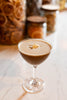 Cocktail in a glass with a creamy texture on a marble surface