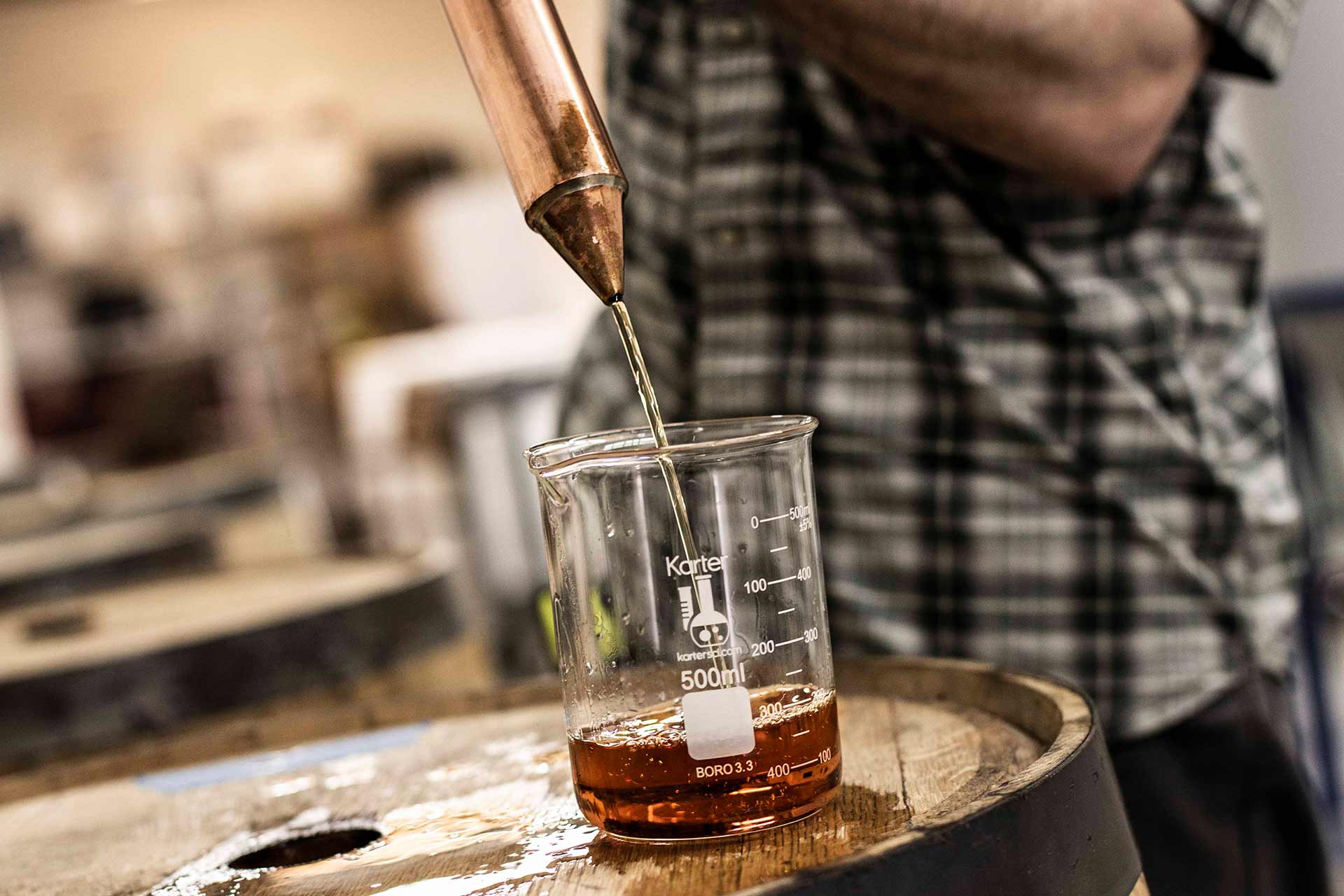liquid being poured into measuring cup